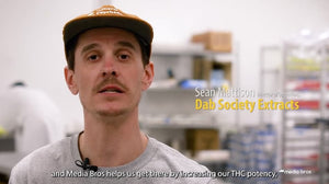 A man in a laboratory speaking idirectly to the camera.